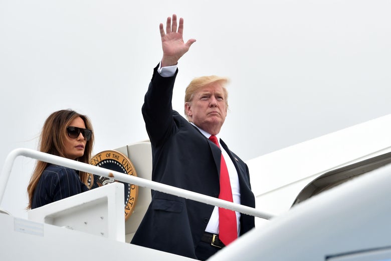 Donald Trump and Melania Trump board Air Force One.